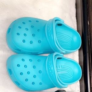 Two pairs of crocs ! Light blue and black